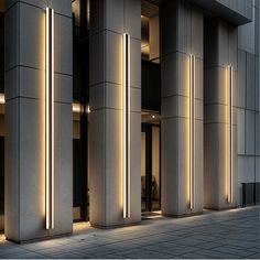 an empty building with columns lit up at night