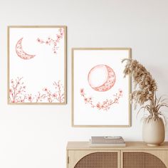 there are two pictures hanging on the wall next to a vase with flowers in it