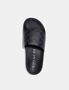 These laidback, sporty slides are crafted in our Signature canvas. The contoured footbed and rubber sole provide all-day comfort. ; Signature coated canvas upper Man-made leather footbed Man-made leather outsole Slip on Only available in full sizes, go up to the nearest whole size if you take a half size Coach Casual Slides With Cushioned Footbed, Coach Summer Slip-on Slides, Coach Slip-on Sandals With Textured Footbed, Luxury Leather Sole Slip-on Slides, Black Slip-resistant Sports Slides, Slides Women, Signature Canvas, Slide In, Go Up