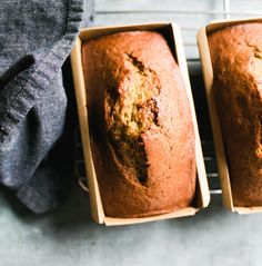 two loafs of banana bread sitting next to each other