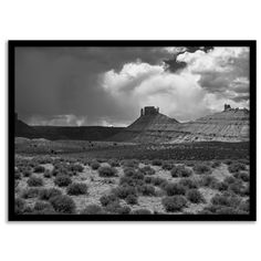 black and white photograph of desert landscape with clouds