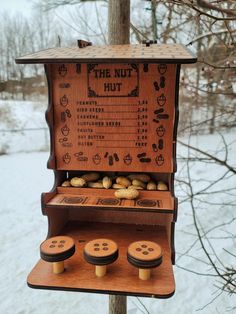 the nut hut is made out of wood and has buttons on it