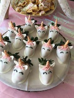 there are many unicorn shaped desserts on the table