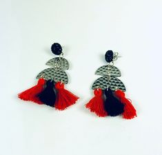 A trio of festive black and red tassels dangle from gorgeous hammered gold semi circles which are suspended from sparkling black posts. These are wonderful casual earrings that look equally wonderful with a basic tee or a dress. Earrings measure 2 1/4 in x 1 in. Dress Earrings, Casual Earrings, Cardboard Jewelry Boxes, Yellow Polka Dot, Cincinnati Bearcats, Hammered Gold, Antique Earrings, Hammered Silver, Fun Earrings