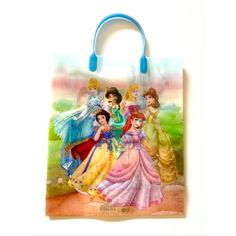 a bag with princesses on it is hanging from the handle and has blue handles