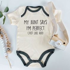 a baby bodysuit that says, my aunt says i'm perfect just like her