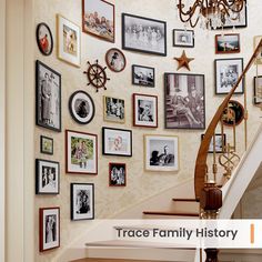 a staircase with many pictures on the wall