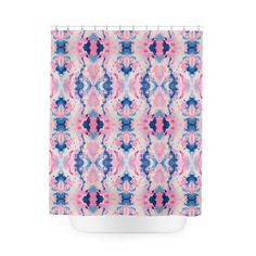 a shower curtain with pink and blue designs on it