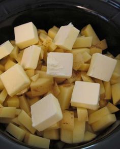 cubes of cheese are sitting in the crock pot