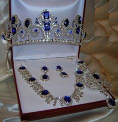 a tiara and earrings are in a box