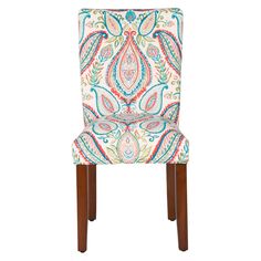 an upholstered dining chair with colorful paisley print on the back and wooden legs