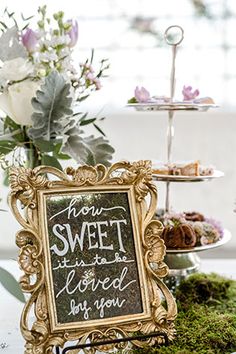 a sign that says how sweet it is to be loved by you on the table