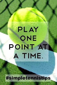 a tennis ball sitting on top of a court with the words play one point at a time