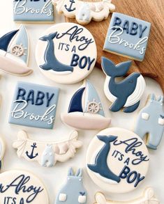 baby its a boy decorated cookies on a table