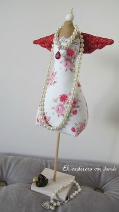 a mannequin is adorned with pearls and beads