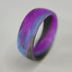 * THE RING - This particular ring boasts a traditional round band, slight comfort fit and a matte finish. The matte finish is extremely durable with a purple and blue glow. A high gloss finish is optional, leave us a note on the order if you would like a gloss finish. Made with pure carbon fiber and composite for the glow. Since each ring is individually handcrafted, there might be slight differences in each ring giving you a one of a kind piece. * PROPRIETARY NASA TECHNOLOGY IN EVERY RING - Hav Handmade Black Promise Ring, Pink Wedding Band, Nasa Technology, Glow Ring, Carbon Fiber Rings, Blue Glow, Amazon Handmade, Pretty Rings, High Gloss Finish