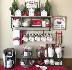 the coffee bar is decorated for christmas with red and white decorations on shelves above it