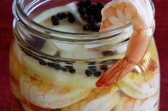 a jar filled with bananas and blueberries sitting on top of a red table cloth