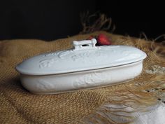 a white platter with a strawberries on it sitting on top of a burlock