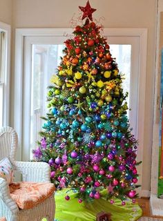 a brightly colored christmas tree in a living room