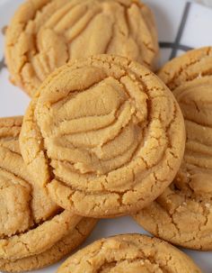 several peanut butter cookies on a white plate