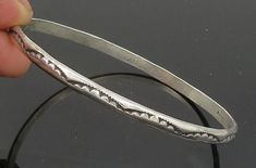 NAVAJO 925 Silver - Vintage Etched Pattern Shiny Bangle Bracelet - BT8214  NAVAJO 925 Silver - Vintage Etched Pattern Shiny Bangle Bracelet - BT8214  Jewelry Type:         Bracelet   Metal Type:            925 Silver   Metal Size:             7.75"   Stone Type:            N/A  Condition:              N/A  Jewelry Weight:     14.5 Grams  PLEASE NOTE: THIS ITEM IS PRE-OWNED. ALTHOUGH MOST ITEMS ARE IN VERY GOOD CONDITION, SOME MAY NEED CLEANING AND/OR MINOR REPAIRS. WE MAKE A VERY STRONG EFFORT TO UPLOAD CLEAR PICTURES. PLEASE INSPECT ALL PICTURES AND ASK ALL QUESTIONS YOU MAY HAVE PRIOR TO MAKING A PURCHASE. NOT ALL STONES ARE GENUINE, SOME ARE ENHANCED OR CREATED. Jewelry Bangles, Bracelet Metal, Navajo Jewelry, Bangles Jewelry, Metal Bracelets, Bangle Bracelet, Etching, Types Of Metal, Favorite Jewelry