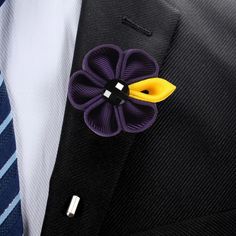 Elevate your style game and add a touch of sophistication to any outfit with this exquisite men's lapel flower. Made from the finest materials and crafted with the utmost care and attention to detail, this accessory is the perfect finishing touch to your attire. With its striking color and intricate design, this lapel flower is a statement piece that is sure to catch the eye of anyone who sees it. The bright, bold hues are perfect for adding a pop of color to a monochrome outfit, while the subtl Flower Lapel, Flower Lapel Pin, Lapel Flower, Monochrome Outfit, Subtle Textures, Red Fire, Color Textures, Flower Fashion, Intricate Design