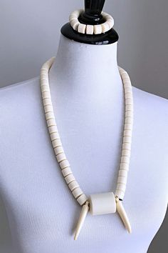 This is a traditional West African off-white beaded necklace for men and women. These jewelry pieces are unisex and are designed to be worn by adults Beads are made of plastic Length ( from neck to chest): 15.5 inches Comes with one (1) matching elastic bracelet These beaded jewelry is an integral part of West African culture. Traditionally it is worn by Royalty, Chiefs, and those who are part of the Royal households among many kingdoms in West Africa. It is also worn by brides and grooms during White Hand-strung Long Necklace Beads, White Hand-strung Long Bead Necklace, Traditional White Single Strand Beaded Necklace, Elegant White Wooden Beaded Necklaces, White Wooden Beads Jewelry, Elegant White Beaded Necklace With Wooden Beads, Elegant White Beaded Necklaces With Wooden Beads, White Wooden Beaded Jewelry, Vintage White Hand-strung Necklaces