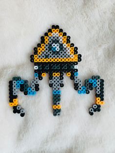 the bead art is made to look like an image of a man holding a baby