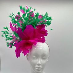 Handmade by Featured Milliner of The Kentucky Derby Museum 2023 & 2024! Pink and Green feathers  Attaches with headband.  Not taking customs this year--Derby 150 is going to be massive and mom life keeps me running! However, happy to suggest pieces that will coordinate with your outfit. If you don't love the way this attaches to your head--message me!  I can swtich *most* pieces to your preference. Clip, Headband OR Elastic Cord  NOTE: Heavier pieces with extravagant florals etc require the stability of a headband. NO RETURNS/EXCHANGES due to nature of product (special occasion and head wear). Not all screens/lighting are created equal. Make sure you are happy with the color match before ordering! If you have any concerns, let me know--here to help. Just say the word. Head Message, Clip Headband, Green Feathers, Classy Hats, Derby Fascinator, Head Wear, Kentucky Derby Hat, Derby Hat, Fancy Hats