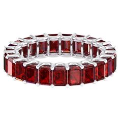 a red bracelet with square cut stones