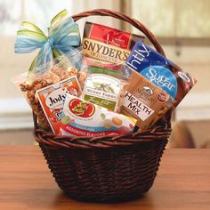 a basket filled with snacks sitting on top of a wooden table