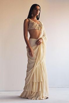 Beige georgette saree with layered ruffle border and attached draped pallu. Paired with a net padded blouse with all over tear drop tassels, mirror and thread hand embroidery. - Aza Fashions Reception Saree Look, Beige Saree, Arpita Mehta, Reception Saree, Saree Georgette, Designer Kurti Patterns, Ruffle Saree, Kurti Patterns, White Saree