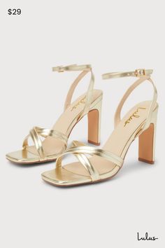 Your Saturday night 'fit just got a little more glamorous thanks to a wow-worthy look like the Lulus Milanii Gold Square Toe Ankle Strap High Heel Sandals! Make a statement wherever you go with these shiny faux leather heels that feature a single sole silhouette, a square toe bed, and crisscrossing toe straps. Matching straps sprout from the sides to wrap and secure around the ankle with a shiny gold buckle. A flirty blade heel lends a trendy finishing touch! 4" wrapped blade heel. Lightly cushioned insole. Rubber sole has nonskid markings. Man Made Materials. Imported. Lulus | Milanii Gold Square Toe Ankle Strap High Heel Sandal Heels. Gold Sandals With 4-inch Heel For Date Night, Gold Sandals With Wrapped Heel For Date Night, Cute Gold Heels, Gold Sandals With Padded Heel For Date Night, Glamorous Gold Heels For Date Night, Gold Heels With Padded Heel For Date Night, Gold Heels For Summer Date Night, Gold Block Heel For Date Night, Gold Block Heel Heels For Date Night