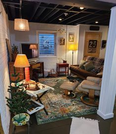 a living room filled with furniture and a christmas tree in the middle of the room