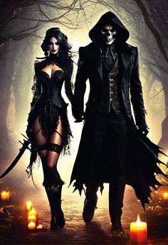 two people dressed up as witches walking through the woods with candles in front of them