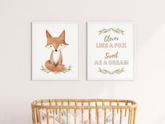 two prints on the wall of a baby's room