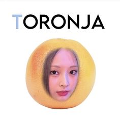 an orange with a woman's face and the words toronja on it