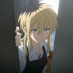 an anime character with blonde hair pointing at something