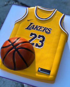 a cake made to look like a jersey and basketball