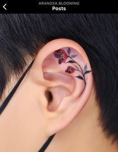 an ear with flowers painted on it