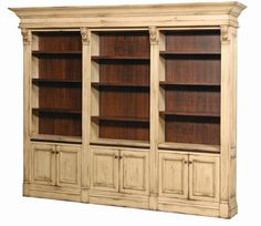 a large wooden bookcase with doors and drawers