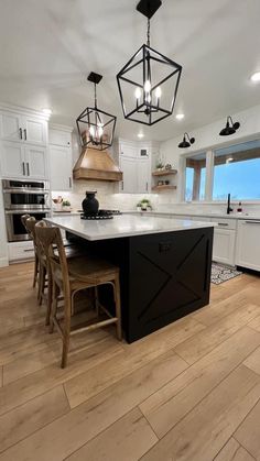 a large kitchen with an island in the middle