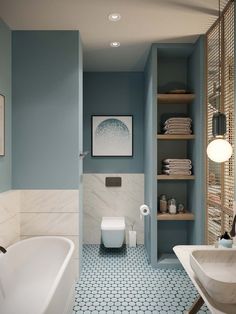 a bathroom with blue walls and flooring has a white bathtub in the corner