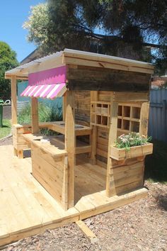 a wooden deck with an outdoor bar built into it