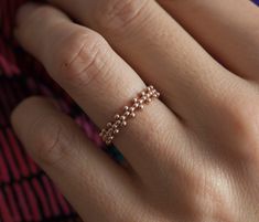 Simple beaded crown ring in 14k gold. This ring is designed for those who love simplicity with a slight of twist. This ring is perfect as a simple wedding band for her. Ring on the picture is polished. Also matte style is possible. If you would like to have matte band please leave a note at the checkout. Width of the band is 3.80mm and the thickness of it is 1.50mm. Open spaces between the millgrains measure 1.60mm Gemstones can be set in this band. Pleae contact me for pricing. Sizes available: Simple Wedding Band, Rings Pearl, Beaded Crown, Diy Beaded Rings, Gelang Manik-manik, Bracelet Miyuki, Beads Craft Jewelry, Ring Rosegold, Her Ring