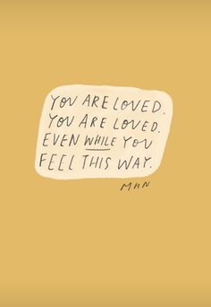 a handwritten note with the words you are loved, you are loved even while you feel this way