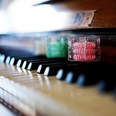 a close up of a piano with some candy on it