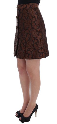 Dolce & Gabbana Skirt Gorgeous brand new with tags, 100% Authentic Dolce & Gabbana brown floral brocade skirt with silk stretch inner lining. This item comes from the exclusive MainLine Dolce & Gabbana Collection. Model: Above knee bubble skirt Color: Brown and black floral brocade Material: 54% Cotton, 34% Rayon, 12% Silk Antique gold with red stone buttons Back zipper and button closure Logo details, logo engraved hardware Made in Italy Brocade Skirt, Bubble Skirt, Dolce E Gabbana, Brown Floral, Dolce & Gabbana, Above Knee, Black Floral, Jimmy Choo, Womens Skirt