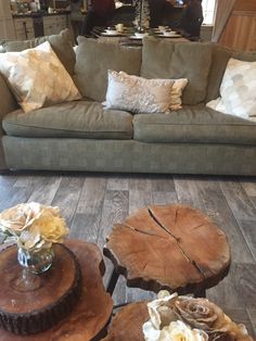 a living room filled with furniture and wooden tables